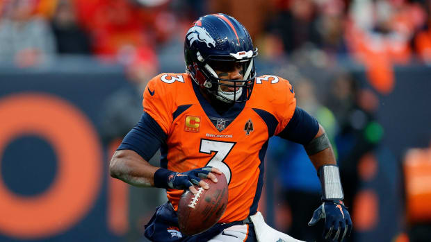 Denver Broncos quarterback Russell Wilson (3) scrambles in the fourth quarter against the Kansas City Chiefs at Empower Field at Mile High.